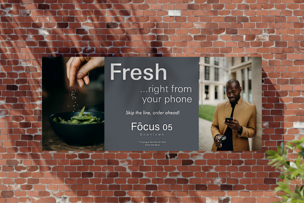 Restaurant billboard on a red brick wall